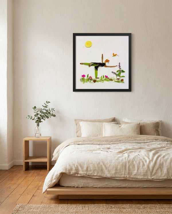 Grounded in Light art in a black frame hung in a bedroom