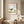 Grounded in Light art in a red oak frame hung in a bathroom