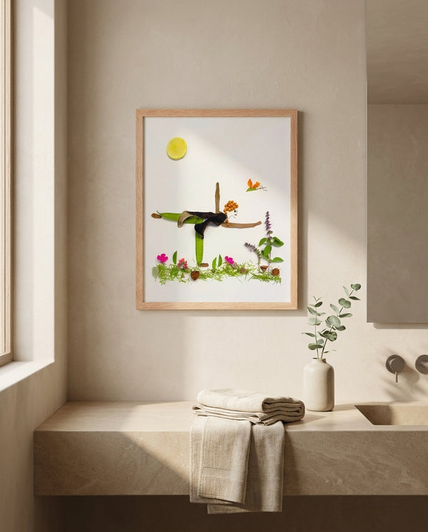 Grounded in Light art in a red oak frame hung in a bathroom