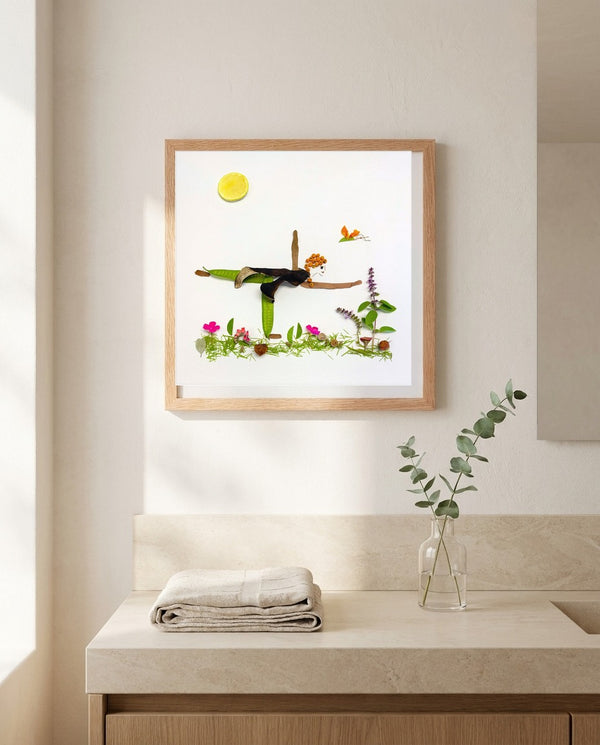 Grounded in Light art in a red oak frame hung in a bathroom