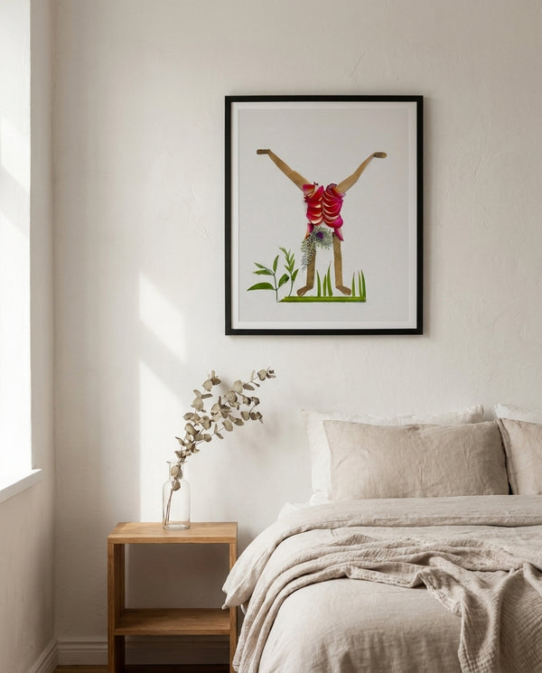 Handstand Star botanical handstand wall art print in a black frame hanging in a bedroom