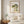 Hanging in Nature in a red oak frame above a bed in a restful bedroom