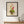 Happy Little Vase whimsical floral still life wall art print in a black frame hanging in an entryway