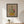 Lily Row botanical lily still life wall art print in a black frame hanging in an entryway