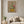 Lily Row botanical lily still life wall art print in a white frame hanging in a living room