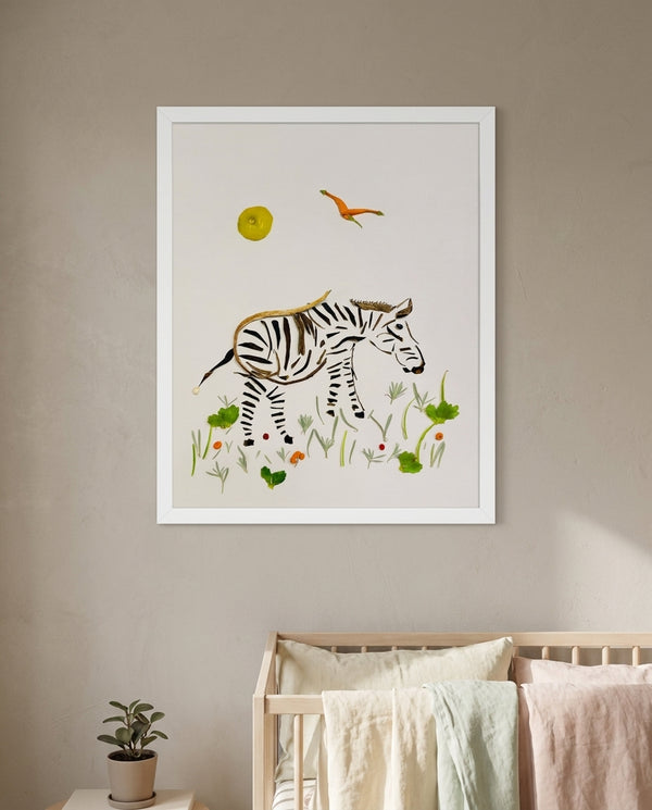 Little Grazing Zebra botanical animal wall art print in a white frame hanging in a nursery