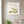 Meadow Donkey art in a white frame styled in a nursery