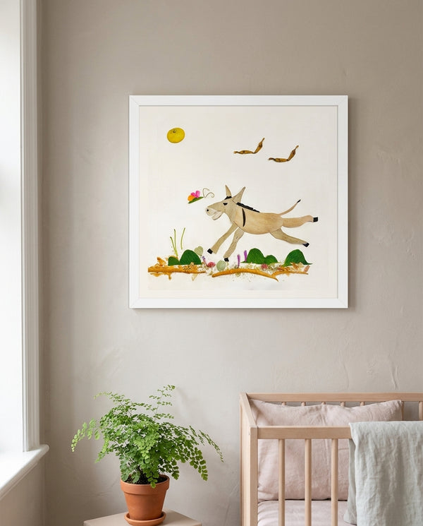 Meadow Donkey art in a white frame styled in a nursery