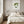 Meadow Muse art in a white frame hung in a serene bedroom