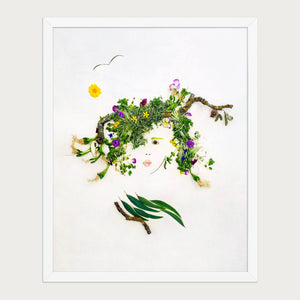 Meadow Muse feminine nature-inspired wall art in a white frame on a warm cream background