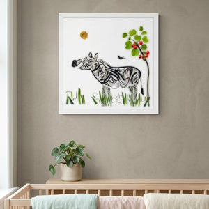 Meadow Zebra print in a white frame hanging in a nursery