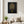 Midnight Garden Lady art in a black frame styled in a living room