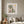 Mimosa Morning botanical garden scene wall art print in a white frame hanging in a living room