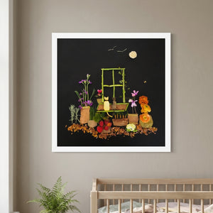 Night Garden Cats botanical cat scene wall art print in a white frame hanging in a nursery