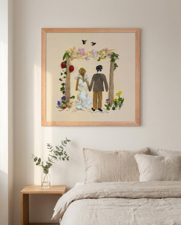 Petal Arch Wedding botanical wedding scene wall art print in a red oak wood frame hanging in a bedroom
