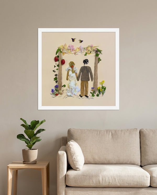 Petal Arch Wedding botanical wedding scene wall art print in a white frame hanging in a living room