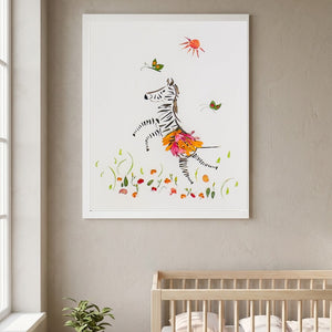 Petal Dance Zebra playful floral animal wall art print in a white frame hanging in a nursery