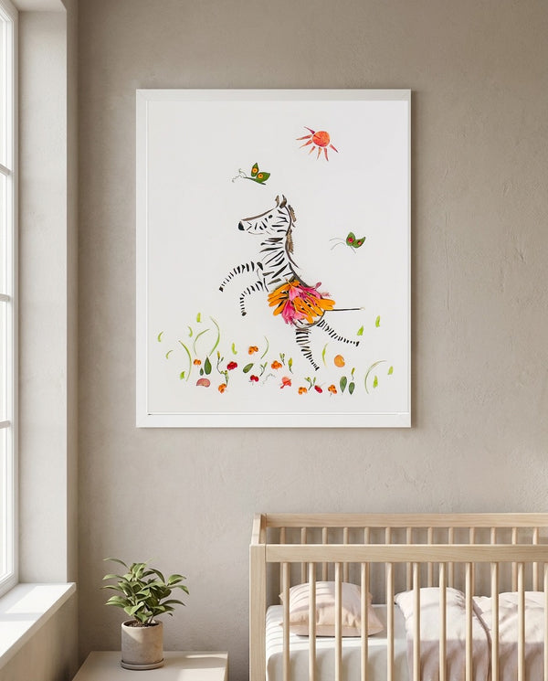 Petal Dance Zebra playful floral animal wall art print in a white frame hanging in a nursery