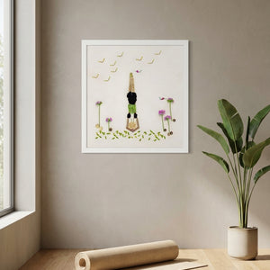 Petals in Balance art in a white frame styled in a yoga studio