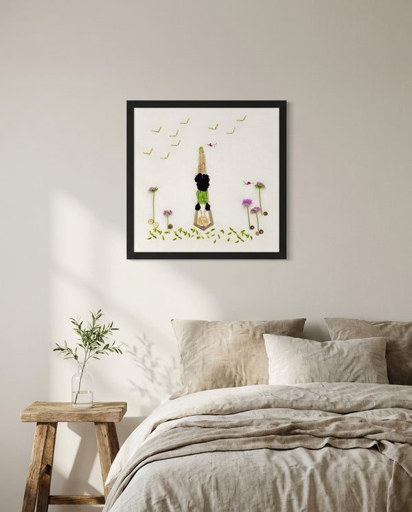 Petals in Balance art in a black frame styled in a bedroom