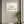 Poised in Nature art in a white frame styled in a yoga studio