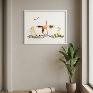 Poised in Nature art in a white frame styled in a yoga studio