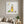 Quiet Day Wanderer art in a white frame styled in a living room