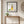 Quiet Day Wanderer art in a black frame styled in an entryway