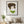 Quiet Forest Woman art in a black frame hung in a living room
