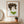 Quiet Forest Woman art in a red oak frame hung in an entryway