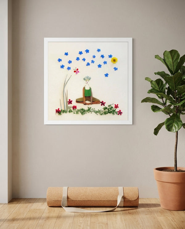 Quiet Joy Pose art in a white frame hanging in a serene yoga studio
