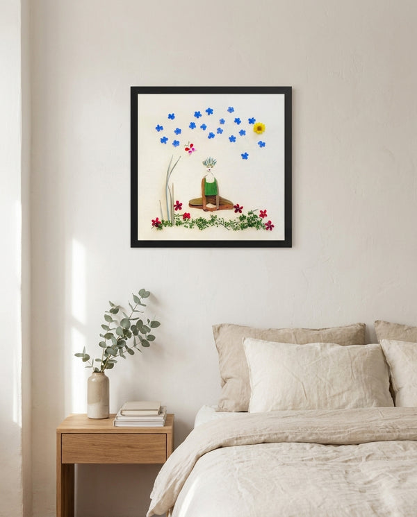 Quiet Joy Pose art in a black frame hanging in a calm bedroom