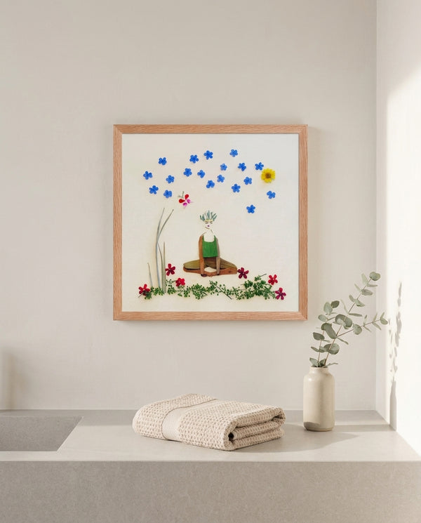 Quiet Joy Pose art in a red oak wood frame hanging in a bathroom