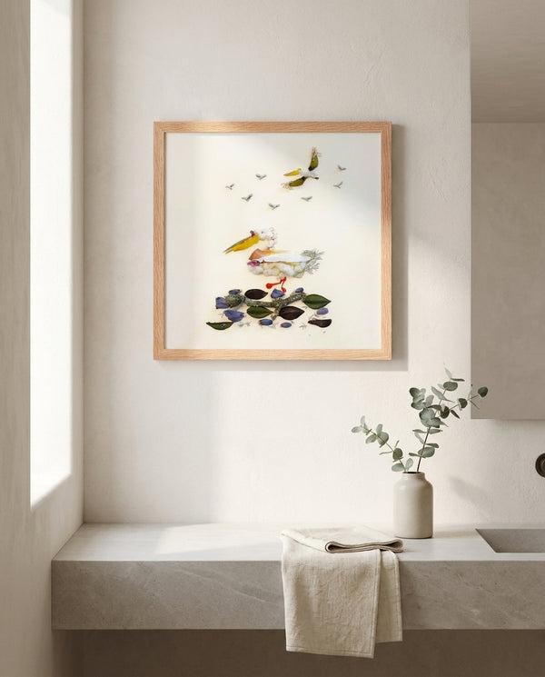 Quiet Wing Companions art in a red oak wood frame in a bathroom