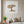 Rest Beneath the Tree art in a white frame in a serene living room