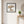 Rest Beneath the Tree art in a black frame in an entryway