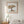 Rest Beneath the Tree art in a red oak wood frame in a bedroom