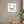 Resting in the Tropics in a white frame hung in a serene yoga studio