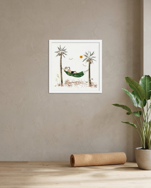 Resting in the Tropics in a white frame hung in a serene yoga studio