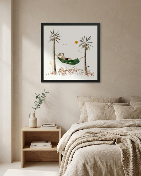 Resting in the Tropics in a black frame hung above a linen bed