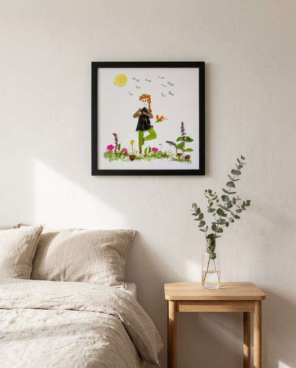 Rooted Tree Pose art in a black frame hung in a bedroom