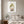 Soft Harvest Lady art in a white frame in a serene bedroom
