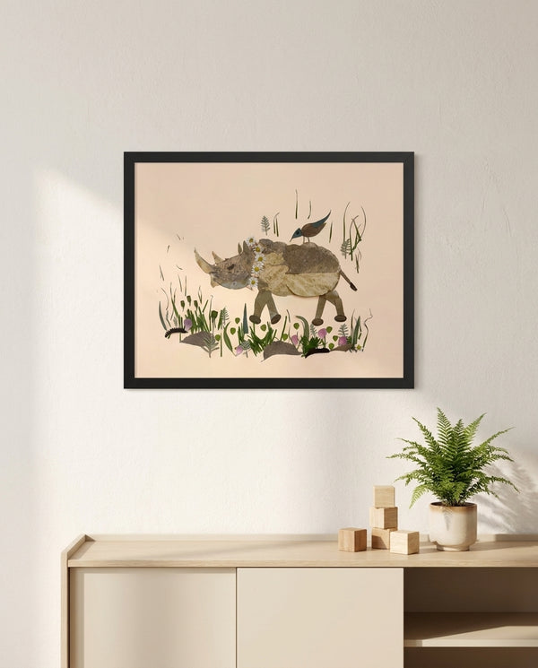 Songbird Rhino botanical animal wall art print in a black frame hanging in a kids room