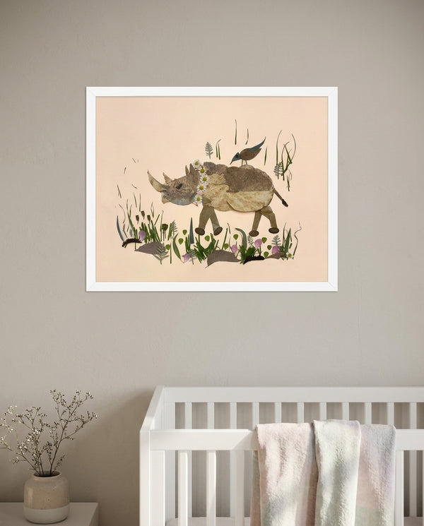Songbird Rhino botanical animal wall art print in a white frame hanging in a nursery