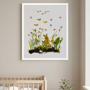 Springtime Bunny botanical bunny wall art print in a white frame hanging in a nursery