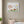 Squirrels Beneath the Leaves art in a white frame in a serene nursery