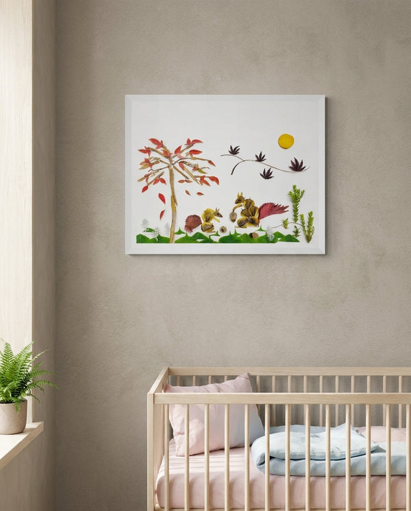 Squirrels Beneath the Leaves art in a white frame in a serene nursery