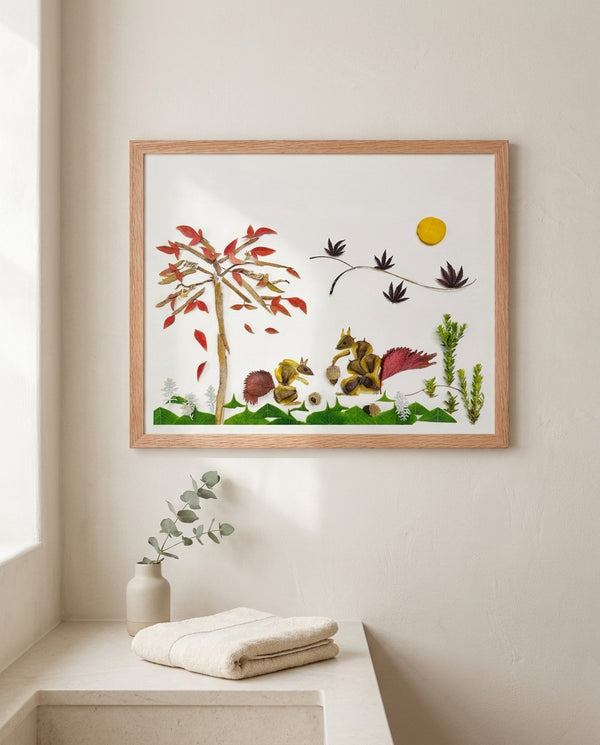 Squirrels Beneath the Leaves art in a red oak wood frame in a bathroom