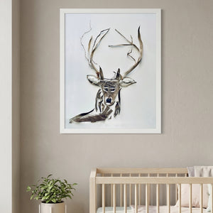 Still Forest Deer art in a white frame in a serene nursery