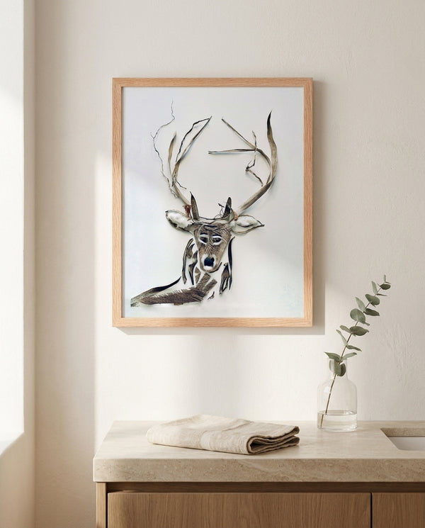 Still Forest Deer art in a red oak wood frame in a bathroom